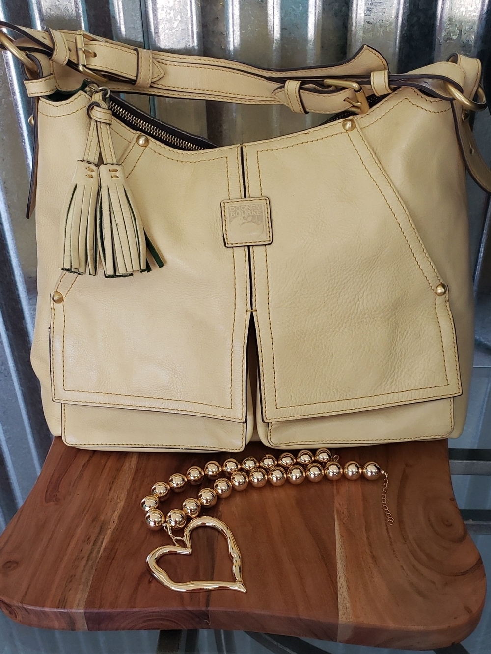 Dooney & Bourke Cream Leather Shoulder Bag with Tassel
